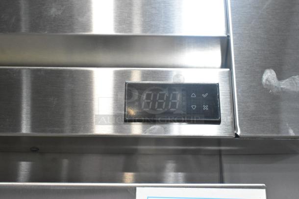 Brand new True STG1RRI89-1S-HC commercial cooler with digital display, stainless finish, 120 volts, scratch visible.