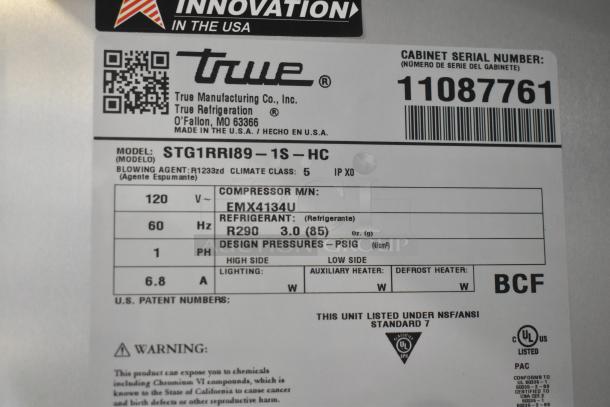 Alt text: Label of True STG1RRI89-1S-HC commercial cooler showing model details, 120V, 1 Phase, refrigerant R290, and serial number.