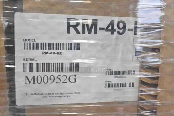 Brand new Hoshizaki RM-49-HC cooler. Scratch and dent model, serial M00952G. 115 volts, 1 phase. Warning label visible.