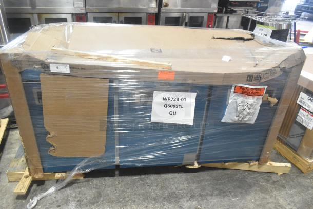 Alt text: Brand new Hoshizaki WR72B-01 commercial cooler, scratch and dent, 3-door, 115V, wrapped on pallet with labels.