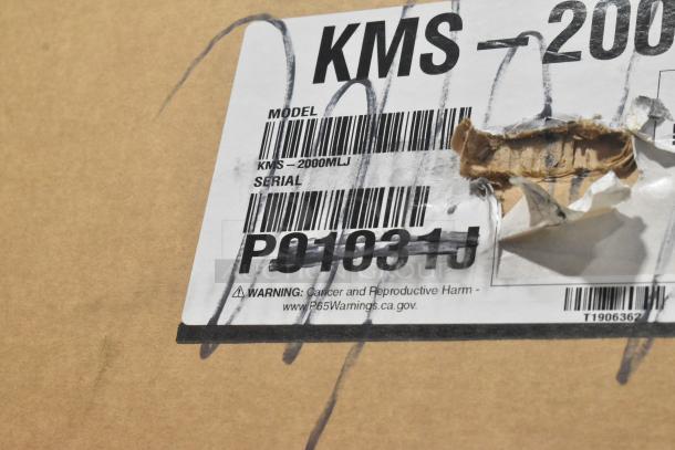 Brand new Hoshizaki KMS-2000MLJ Crescent Cube Ice Machine, 1938 lb/24 hr output, with scratch and dent. Markings show model and serial number.