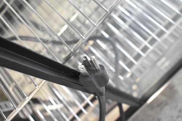 Brand new Avantco 177HDC48 48" heated display case plug detail, showing three-shelf interior with sliding doors.