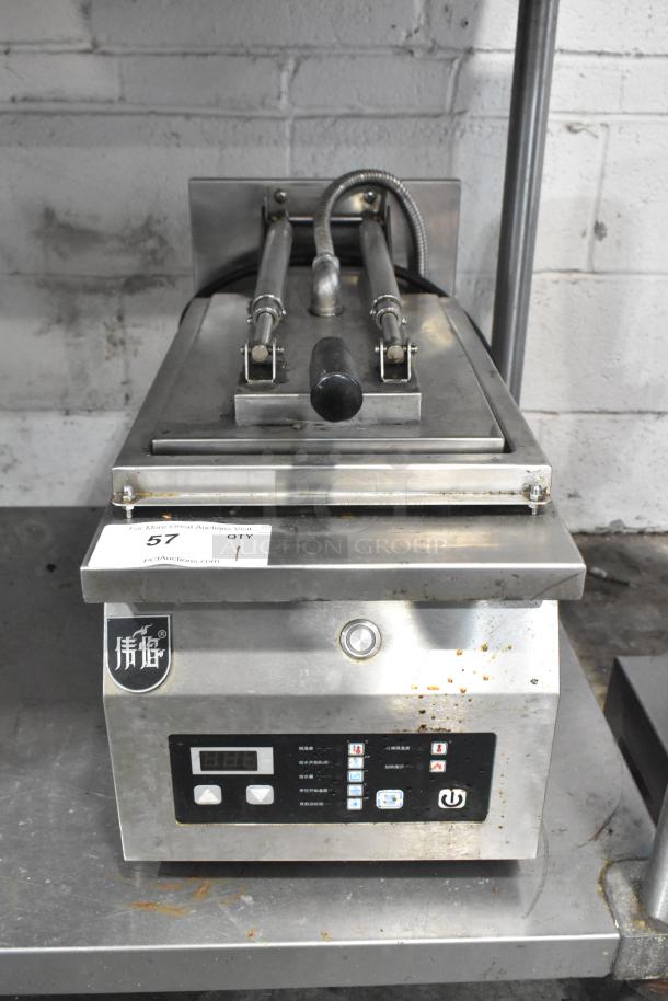 Commercial countertop electric panini press, stainless steel, 208 volts, 1 phase, digital display, good condition.