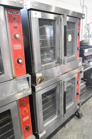Two Vulcan VC4GD commercial gas convection ovens with view-through doors, thermostatic controls, and mounted on casters.