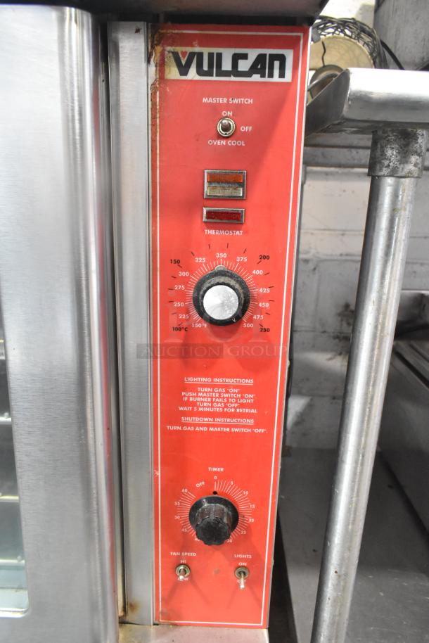 Vulcan VC4GD commercial gas convection oven, view-through doors, thermostatic controls, on casters, visible instructions.
