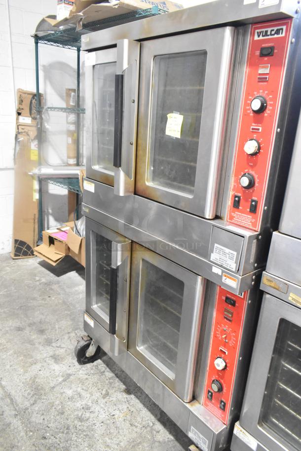 2 Vulcan SG4D4 gas convection ovens with view-through doors, thermostatic controls, on commercial casters, in good condition.