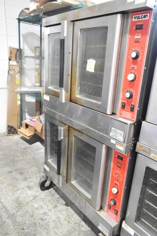 2 Vulcan SG4D4 gas convection ovens with view-through doors, thermostatic controls, on commercial casters, in good condition.