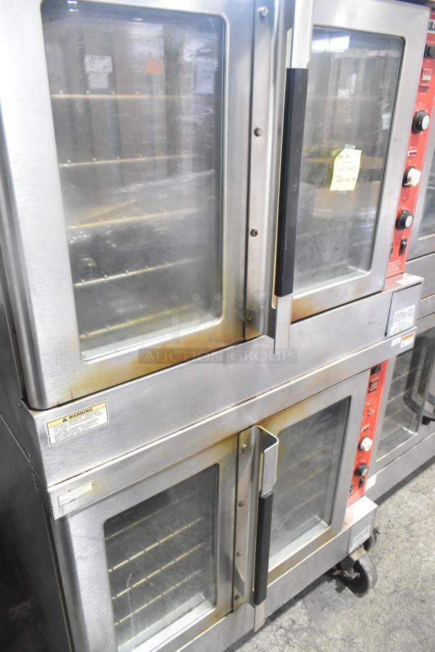 2 Vulcan SG4D4 gas convection ovens with view doors, thermostatic controls on commercial casters. Good condition.