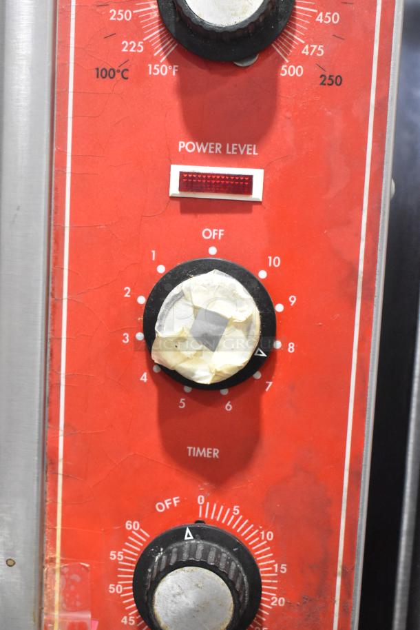 Close-up of Vulcan SG4D4 convection oven control panel with temperature settings and worn labels.