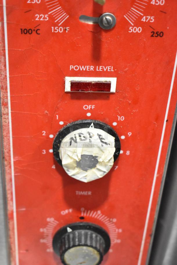 Close-up of Vulcan SG4D4 convection oven control panel showing temperature dials, power level indicator, and taped knob.