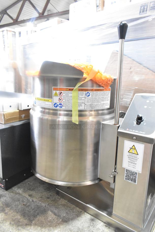 Brand new Cleveland KET-12-T 12-gallon tilting steam kettle, stainless steel, 208/240V, 1 Phase, with safety labels.