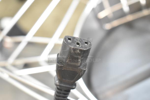 Zumex 08577 Speed Up Juicer power cord connector, black, with identifiable markings, brand new condition.