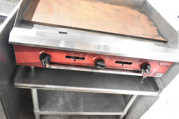 Avantco countertop flat top griddle on equipment stand, features three control knobs, stainless steel, used condition.