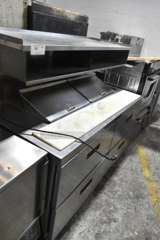 Delfield commercial sandwich salad prep table, mega top with 4 drawers, over-shelf, on casters. 115V, 1 phase.