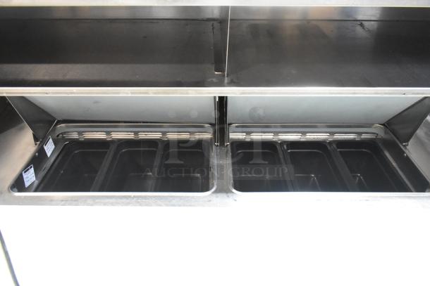 Delfield commercial sandwich prep table with 4 drawers, over-shelf, bain marie top, on casters. 115V, 1 phase.