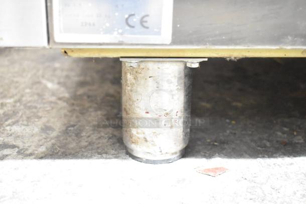 Irinox Commercial Single Door Blast Chiller leg detail, showing steel post and CE label. For 208V, 1 Phase use.