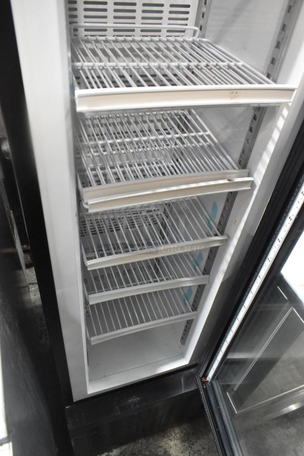 SD105B Commercial Single Door Reach In Cooler, 115 Volts, 1 Phase. Features wire shelves, clean interior, good condition.