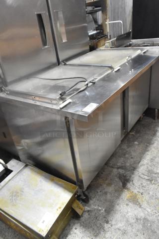 Beverage Air SPE60HC-24M-CL prep table on casters, stainless steel. Features: mega top, 115V, visible power cord, commercial use.