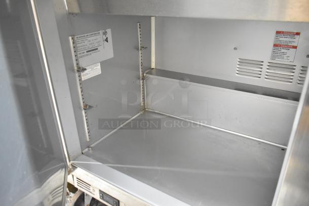 Beverage Air SPE60HC-24M-CL prep table interior, stainless steel, labels showing model, voltage, and safety warnings. Excellent condition.