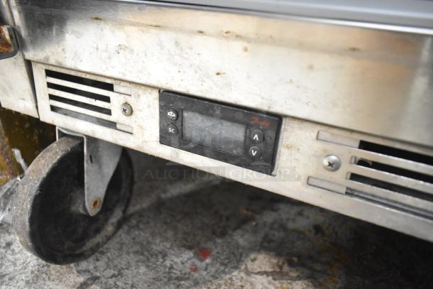 Beverage Air SPE60HC-24M-CL prep table on casters, visible digital control panel, showing wear and use, 115 volts, 1 phase.