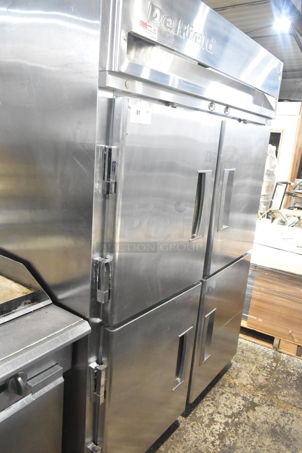 Delfield Commercial 4 Half Door Reach-In Pass-Through Cooler, stainless steel, on casters, good condition.