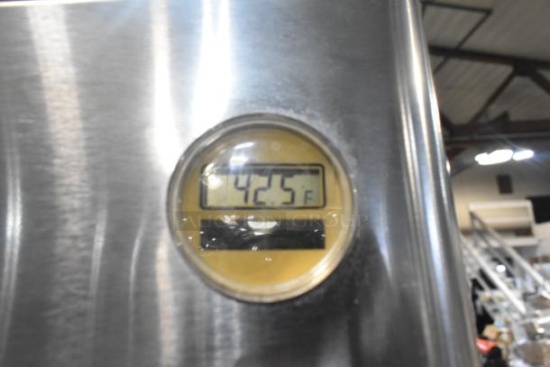 Delfield commercial cooler temperature display showing 42.5°F on stainless steel exterior.