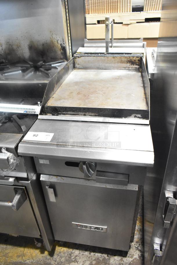 Vulcan VGM18B gas flat top griddle with lower cabinet on casters, 80,000 BTU, visible signs of use, commercial kitchen setting.