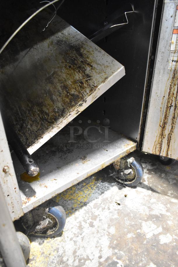 Vulcan VGM18B commercial gas griddle with lower cabinet on casters. Visible wear, 80,000 BTU capacity, suitable for heavy use.