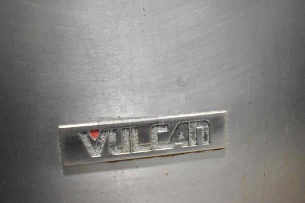 Vulcan VGM18B logo on a gas-powered flat top griddle. 80,000 BTU, stainless steel finish, commercial-grade quality.