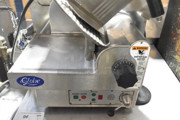 Globe 3850 commercial meat slicer with blade sharpener, 115V, 1 phase. Features control dials, safety labels, and brand logo.
