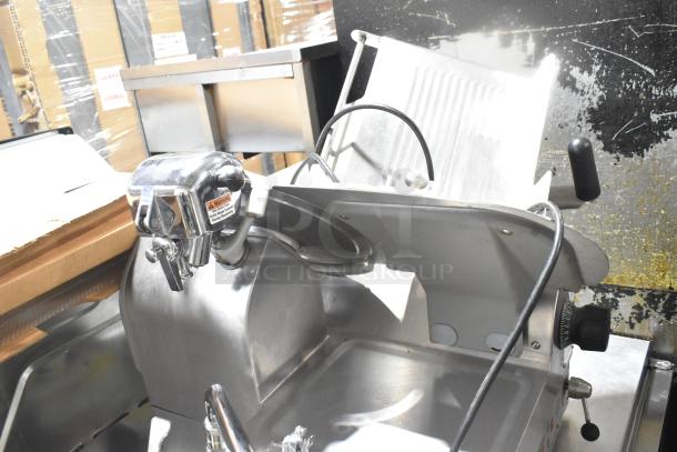 Globe 3850 commercial meat slicer with blade sharpener, 115 volts, 1 phase; features adjustment dials, stainless finish.