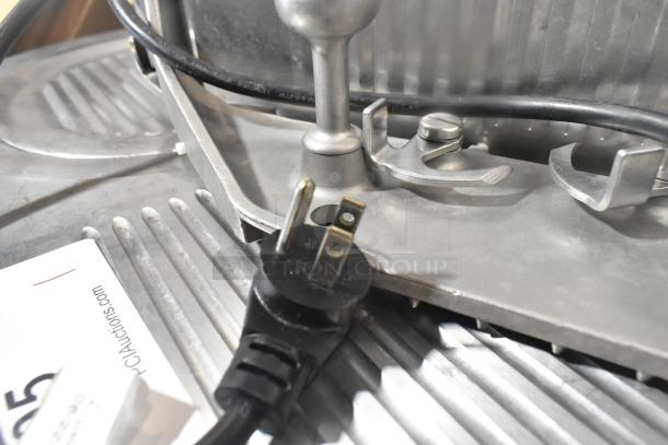 Globe 3850 commercial meat slicer with blade sharpener, 115V. Features stainless steel design, intact power cord.