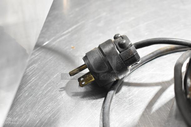 Sanremo SR50A espresso grinder plug and cord on metal countertop. No lid. 115 volts, 1 phase.