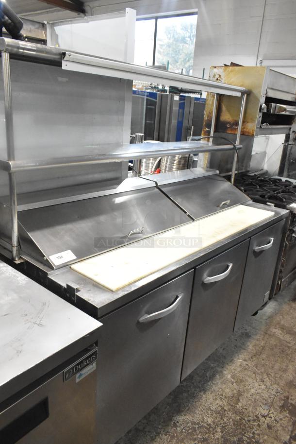 Empura KSP72 commercial sandwich salad prep table on casters. Stainless steel, dual hoods, three doors, 115V, 1 phase.