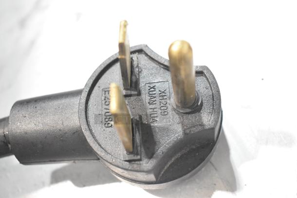 Close-up of Turbochef Encore 2 oven power plug, showing three-prong configuration, model label "X#209 XUAN HUA," in good condition.