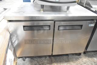 Dukers DUC48F commercial undercounter freezer with two doors, on casters. Stainless steel, 115V, 1 phase. Minor surface wear.