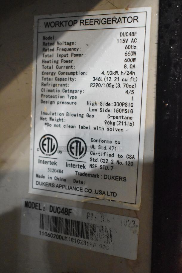 Dukers DUC48F commercial undercounter freezer label showing model, voltage, capacity, and certification details.