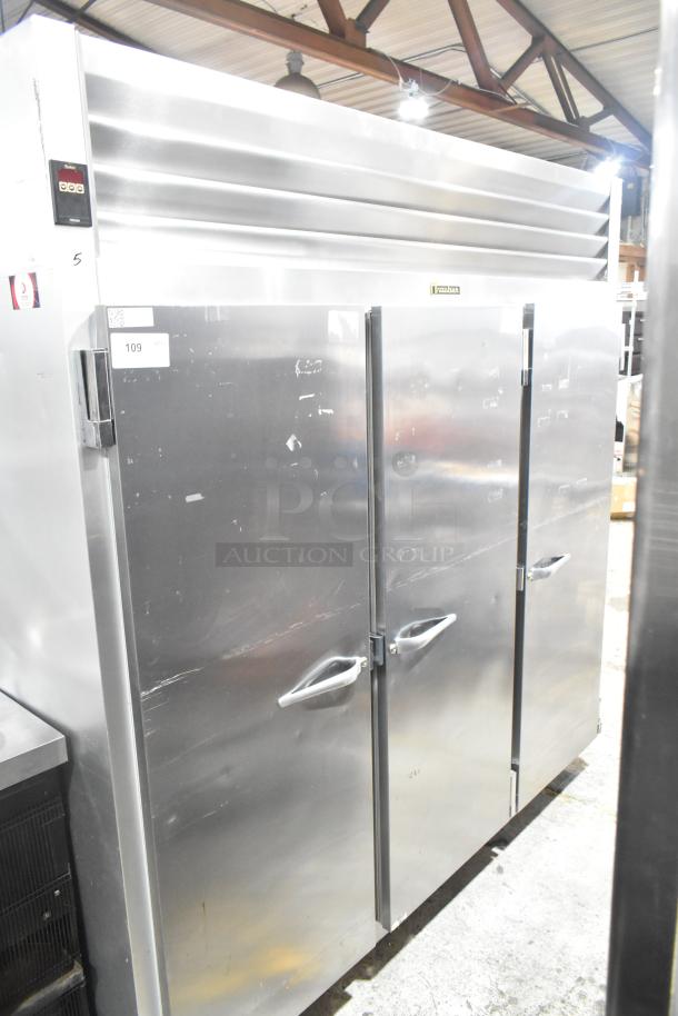 Traulsen RRI232LUT-FHS commercial three-door reach-in freezer, 115V, 1 Phase, stainless steel, visible cosmetic wear.