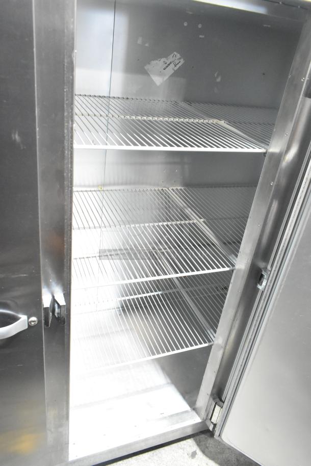 Traulsen RRI232LUT-FHS 3-door commercial reach-in freezer with shelves, stainless steel, 115 volts, 1 phase.