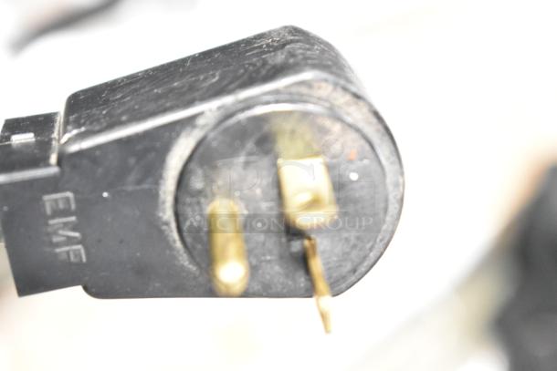 Close-up of a power plug for a Traulsen RRI232LUT-FHS Commercial 3 Door Freezer, 115 volts, 1 phase.
