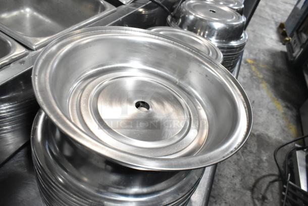 Set of shiny metal dome covers, visible minor scuffs, used condition, designed for food service. Auction for 98 pieces.