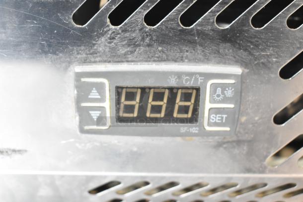 KoolMore commercial refrigerated rail control panel with digital temperature display and settings buttons.