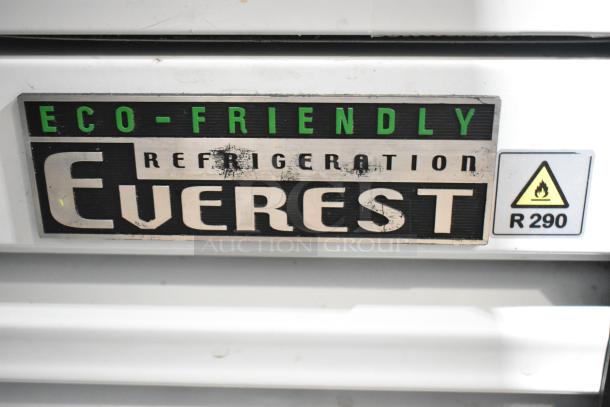 Everest EMGR33 Cooler label, eco-friendly R290 refrigerant, black and green text on a metal surface.