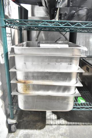6-item lot with 5 stainless steel steam pans and a server countertop 4-well holding bin. Some surface wear visible.
