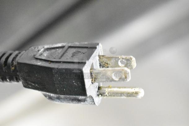 Close-up of a power plug for the Qualite RDFW-1200NP commercial countertop food warmer, 120 volts, 1 phase.