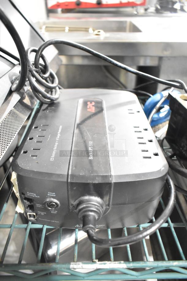 APC Back-UPS 550 uninterruptible power supply, black, multiple outlets and USB port, good condition.