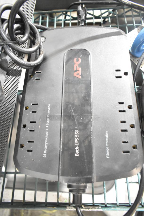 APC Back-UPS 550 uninterruptible power supply, features multiple outlets, offers battery backup and surge protection.
