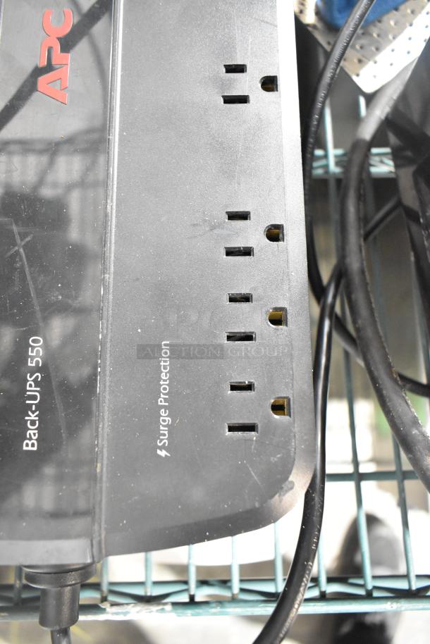 APC Back-UPS 550 uninterruptible power supply showing multiple surge protection outlets, minor scratches visible.