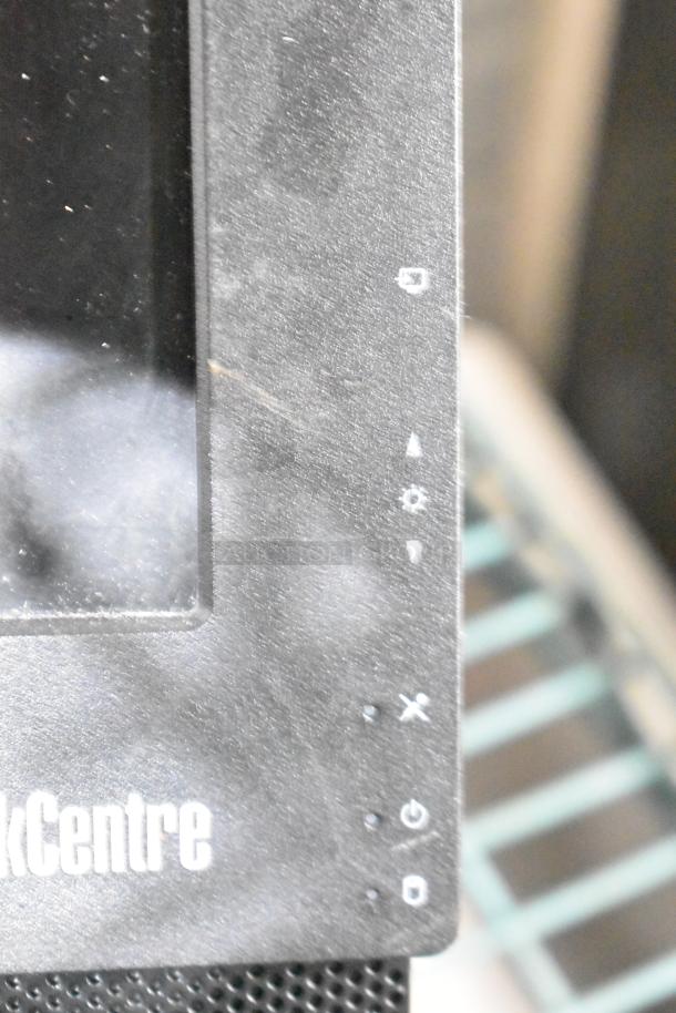 ThinkCentre monitor close-up showing logo and control icons. Item is part of a lot with APC UPS units. Used condition.