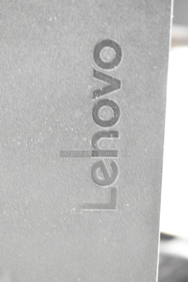 Lenovo ThinkCentre Monitor close-up showing logo. Part of auction with 2 APC Uninterruptible Power Supplies.